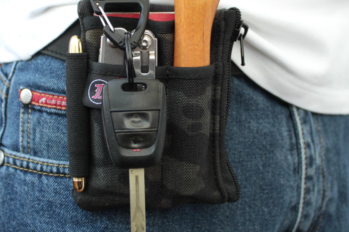 Multi-tool clipped to a belt for everyday carry